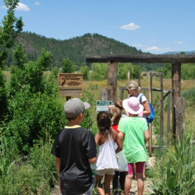 Teacher points to sign when leading students to outdoor classroom