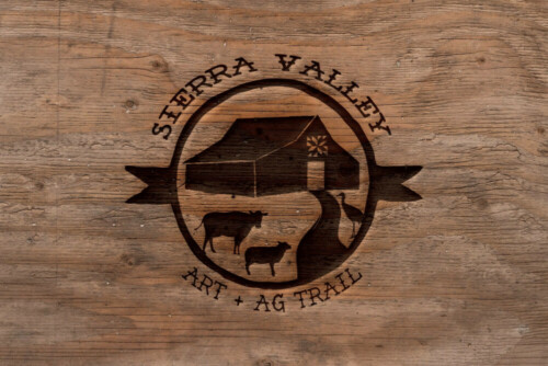 Text and silhouette burned into wood: Sierra Valley Art and Ag Trail