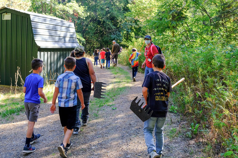 Group of students walk on a trail in Quincy