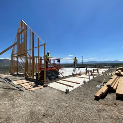 Frame of wall being put up by construction crew