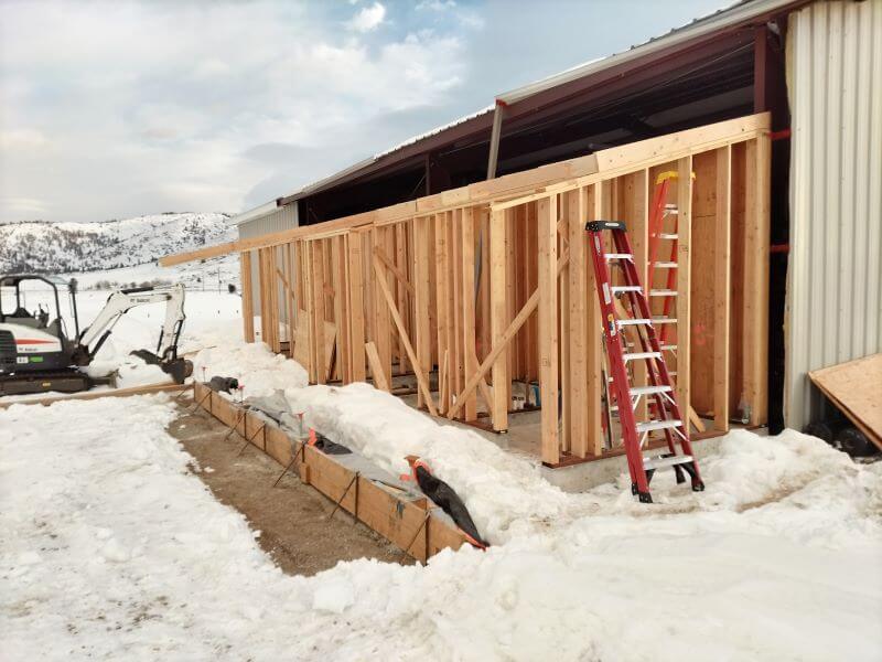 Framing exterior of bathrooms in snow at the Sierra Valley Preserve Nature Center